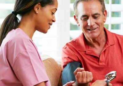 Man getting blood pressure checked by a nurse