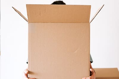 tenant carrying a moving box