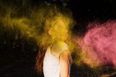 Woman in color powder