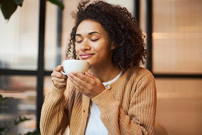 Woman savoring coffee