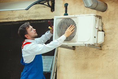 Man fixing hvac unit