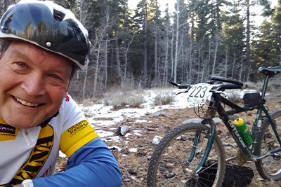 Garrett biking in the woods