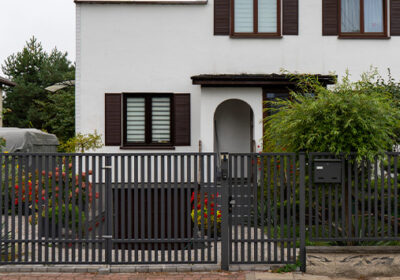 White house with metal fencing