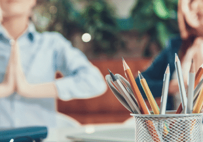 Two women meditating at work