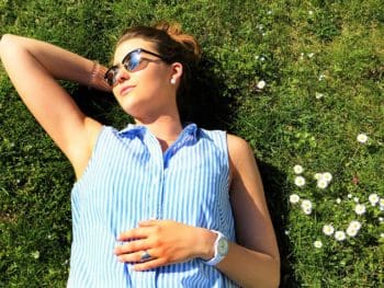 woman getting sun on the grass